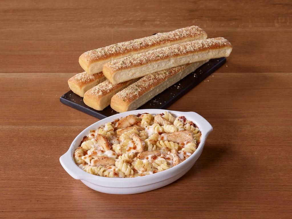 Tuscani Chicken Alfredo Pasta · Grilled chicken breast? Check. Creamy alfredo sauce? Check. Layer of cheese plus a side of breadsticks? Checkmate. Serves 2. Unless you want to keep it all to yourself.