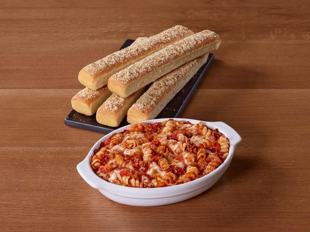 Tuscani Meaty Marinara Pasta · Italian-seasoned meat sauce and rotini topped with cheese, then oven-baked. Served with 5 breadsticks.