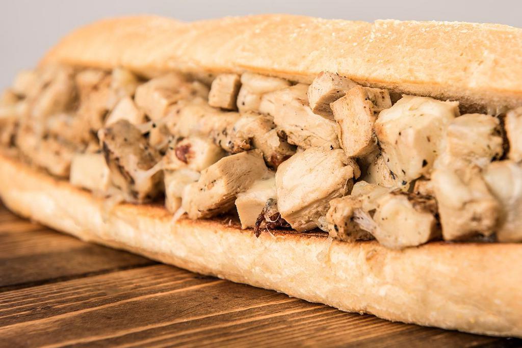 Vegetarian Chicken Cheese Steak Sub · Vegetarian chicken is the star and it's supporting cast is provolone cheese, lettuce, tomato, onion and mayo. 