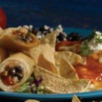 Chicken Taquitos · Three jumbo taquitos stuffed with chicken and black beans. Served with guacamole and sour cr...