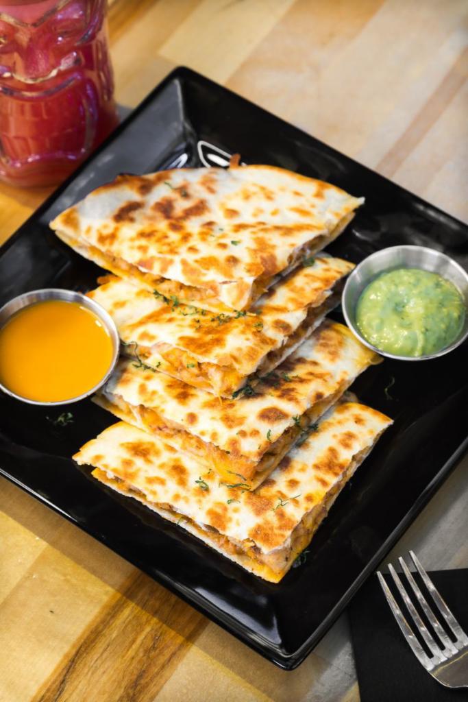 QUESADILLA DU JOUR  · Smoked barbecue chicken , Monterey jack cheddar cheese on a grilled flour tortilla 
