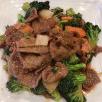 24. Beef with Broccoli · Tender sliced beef with broccoli, carrots and onion stir fried in brown sauce. Served with c...