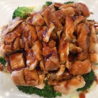 45. Teriyaki Chicken · Grill chicken over steamed vegetable glazed with Japanese sweet teriyaki sauce. Served with ...