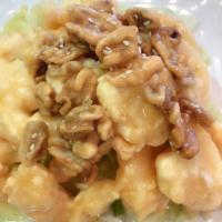 C5. Honey Walnut Shrimp · Crispy shrimp over lettuce glazed with honey walnut sauce topped with walnut.