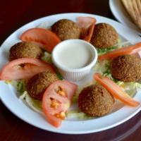 Falafel · Ground chickpeas with parsley, cilantro and other spices, rolled into balls and deep fried. ...