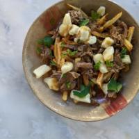 Poutine · French fries, cheese curds, duck gravy 

