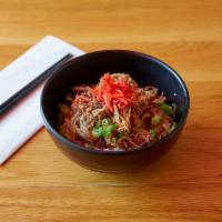 Gyu Don · Thin-sliced stewed beef, scallion, picked red ginger over rice.