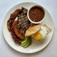 Bandeja Paisa · 6 oz. Grilled skirt steak, chicharron, Colombian sausage, maduros, fried egg, avocado, white...