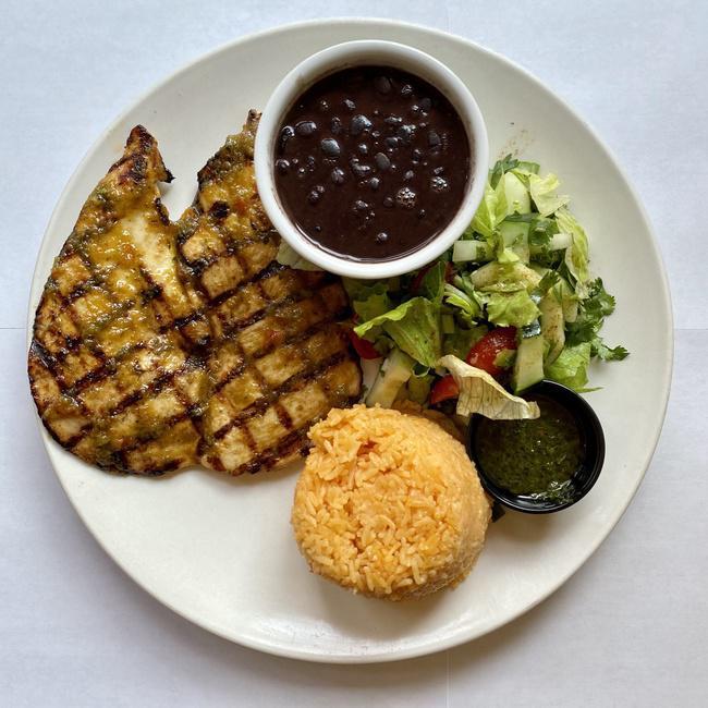 Pollo a la Plancha · Marinated chicken breast seasoned with traditional Latin herbs and spices. Served with rice, beans, salad and chimichurri sauce.