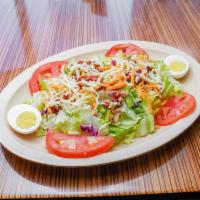 BLT Salad · Fresh green salad, bacon, tomato, green pepper, onion, a hard-boiled egg and cheddar cheese.