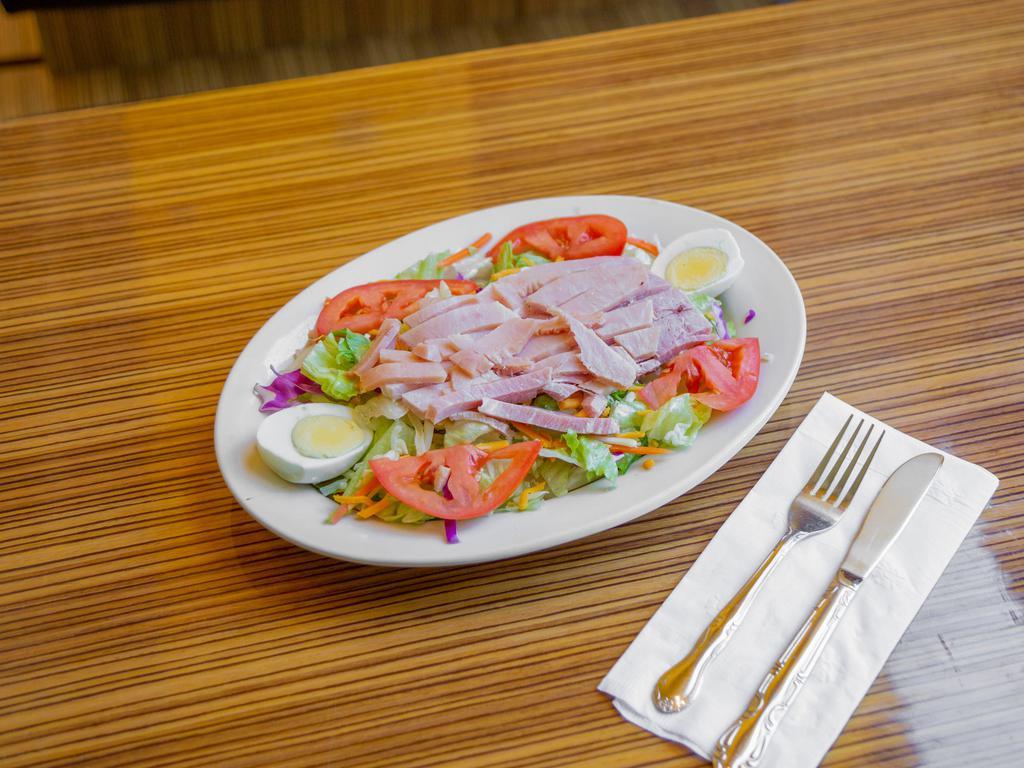 Julienne Salad · Fresh green salad, ham, turkey, cheese, and a hard-boiled egg.