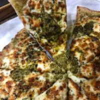 Pesto Pie  · Pesto Base, Mozzarella, and Parmesan Cheese. Served with Red Sauce on the side.