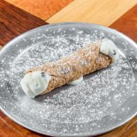 Cannoli · Cannoli shell filled with a blend of ricotta, cane sugar, chocolate drops, vanilla and cinna...