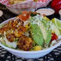 Shrimp Bowl · Whole beans, lettuce, salsa fresca, cabbage, chili chipotle sour cream and cheese.