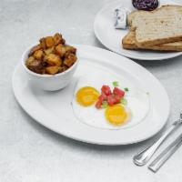 Two Eggs · 2 eggs cooked your way, includes choice of toast and roasted potatoes or brown rice.