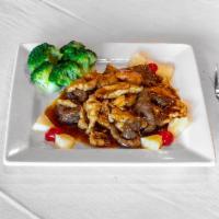 M9. Triple Delight  · Shrimp, chicken and beef with broccoli, snow peas in spicy brown sauce. Hot & spicy.