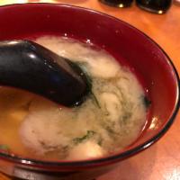 Miso Soup  · Soy bean paste broth with tofu, seaweed, and green onion 