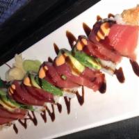 Red Dragon Roll · Shrimp tempura, asparagus, avocado roll topped with tuna, avocado, and special sauce on top