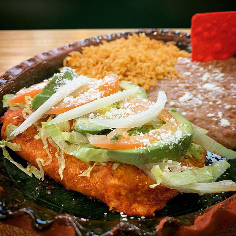Enchiladas Michoacanas · Special sauce, 2 corn tortillas filled with cheese and onions. Topped with sauce, lettuce, tomatoes, onions, sliced avocado and Cotija cheese.