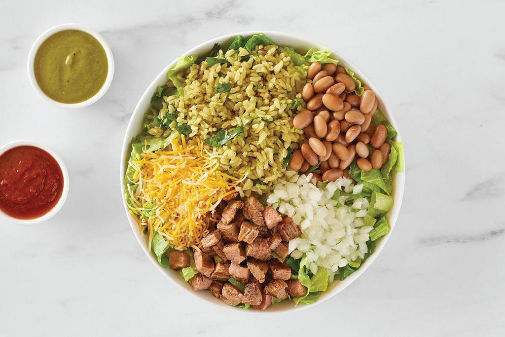 Grilled Angus Steak Bowl · Pinto beans, cilantro-lime rice, cheese, onions, red chili and avocado-verde salsas.
