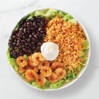 Baja Shrimp Bowl · Shrimp sautéed with onions, garlic and mild salsa, black beans, Spanish rice, sour cream.
