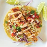 Blackened Fish Taco · Blackened wahoo, coleslaw, chipotle dressing, pico de gallo, with lime.