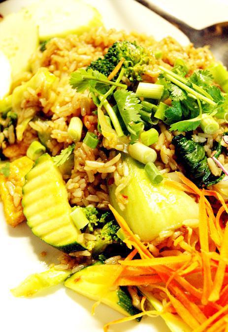 47. Vegetable Fried Rice · Seasonal vegetables, Chinese broccoli, onions, and fried tofu. Stir fried with jasmine rice and flavored with see-iew seasoning.