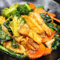 43. Phad See-Iew · Wide rice noodles, fried tofu, broccolis, carrots, and Chinese broccolis. Stir-fried in See-...