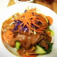 54. Plant-Based Meat with Peanut Sauce · Wide noodles, plant-based meat, seasonal vegetables, caramelized onions & mushrooms, cooked ...