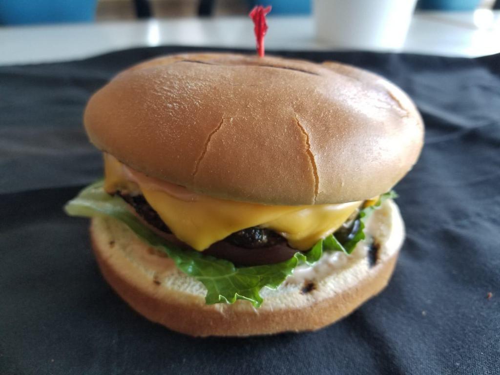Lamb & Beef Burger · Lamb & Beef patty served in a Brioche bun with lettuce, tomatoes, and homemade burger sauce.