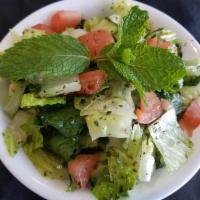 House Salad · Lettuce, tomatoes, and cucumbers mixed with our House dressing.