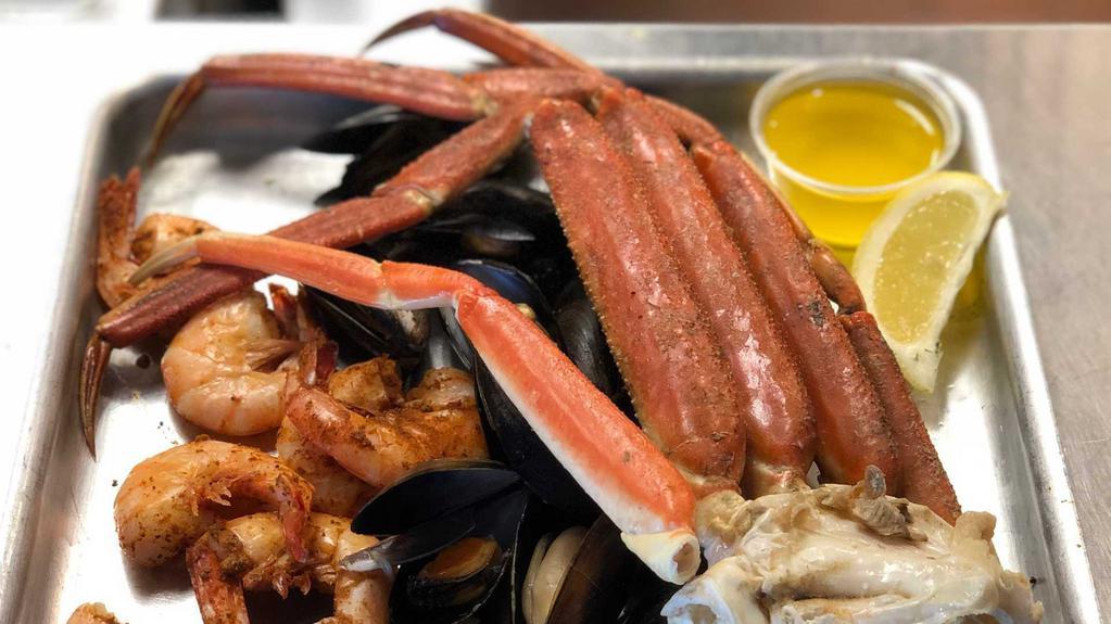 Steamed Sampler · 1/2 lb. shrimp, 12 mussels, and 1/2 lb. crab legs.
