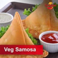 2 Pieces Veg Samosa  · Fried triangular shaped pastry with savory filling of spiced potatoes, peas and onions.