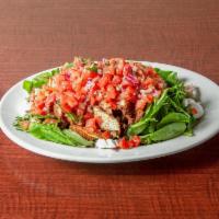 Bruschetta Spring Mix Salad · Fresh spring mix garnished with fresh baby mozzarella, topped with chicken cutlets and fresh...