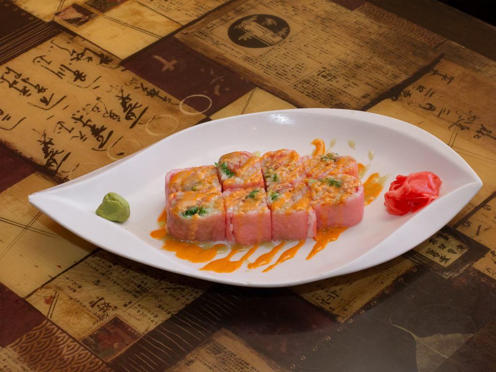 C16. Pink Lady Roll · Tempura salmon, seaweed salad and spicy tuna with soy sheet paper. Spicy.