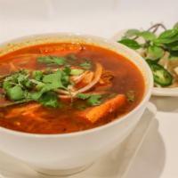 N16. Spicy Noodle Soup · Spicy vegetable broth with lemongrass flavor, thick rice noodle, organic tofu, soy protein, ...