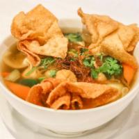 N18. Wonton Noodle Soup · Fried wonton, rice noodle, broccoli, bok choy, carrot, organic tofu, soy protein in vegetabl...