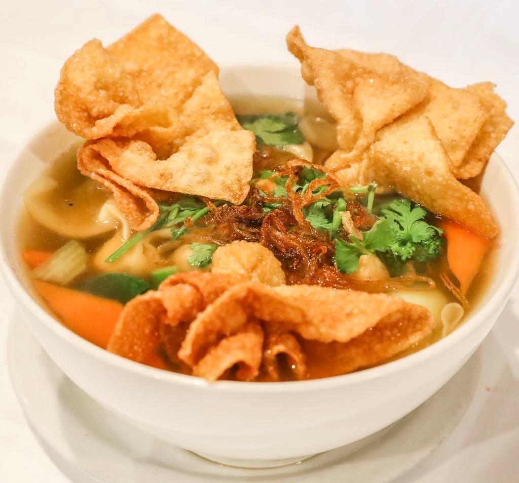 N18. Wonton Noodle Soup · Fried wonton, rice noodle, broccoli, bok choy, carrot, organic tofu, soy protein in vegetable broth.