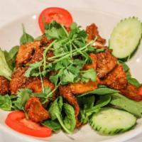 Sp12. Gourmet Lemongrass Soy Chicken · Most popular dish of vegan chicken cooked with lemongrass spices. Served with fresh tomato, ...