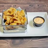 Fried Pickle Chips · Slim breaded pickles and spicy aioli.