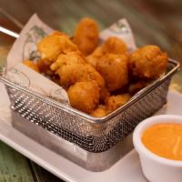 Cheese Curds · White cheddar cheese curds and spicy aioli.