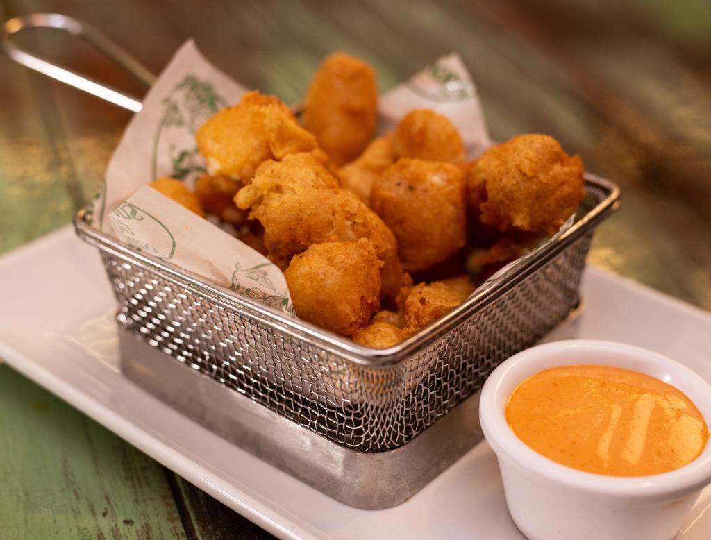 Cheese Curds · White cheddar cheese curds and spicy aioli.