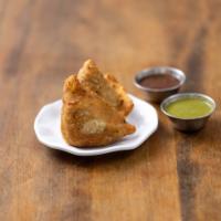 Vegetable Samosa · Indian pastries stuffed with assorted vegetables. Served with homemade green coriander, chut...