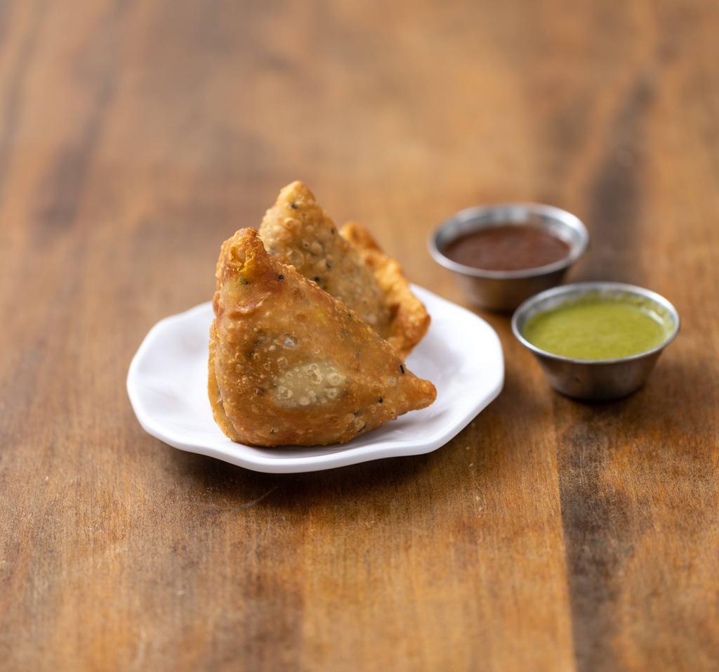 Vegetable Samosa · Indian pastries stuffed with assorted vegetables. Served with homemade green coriander, chutney and onion chutney.