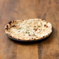 Garlic Naan · Light bread stuffed with fresh crushed garlic and coriander. Baked in the tandoor.