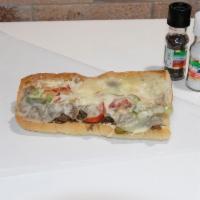 PHILLY POBOY · RIBEYE STEAK, SAUTEED PEPPERS & ONIONS, MOZZARELLA CHEESE, MAYO, CRUNCHY ONION, PEPPERONCINI
