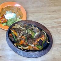 #11. Steak Fajita · Grilled steak cooked with bell peppers, onions and tomatoes. Served with rice, beans, cheese...