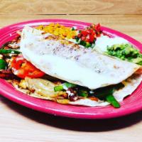#49. Fajita Quesadilla · Grilled tortilla filled with your choice of steak or grilled chicken, onions, tomatoes, bell...