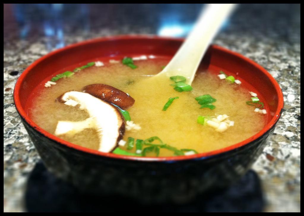 Miso Soup · A traditional soybean broth with tofu, seaweed, green onion, shiitake and enoki mushrooms.