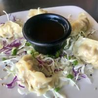 Gyoza · Pan-fried or steamed and citrus soy dipping sauce.
